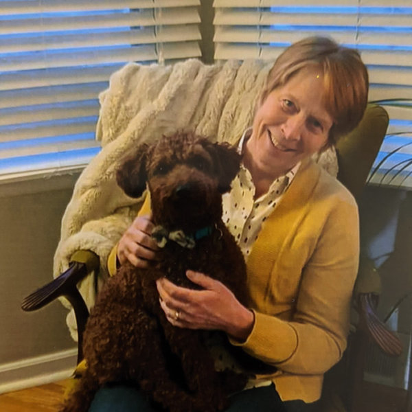 Alice holding a dog