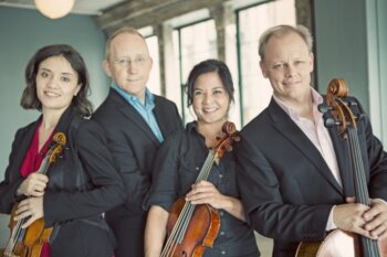 the Arianna String quartet, four musicians with their stringed instruments