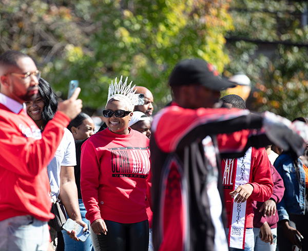 a crowd of alumni outside