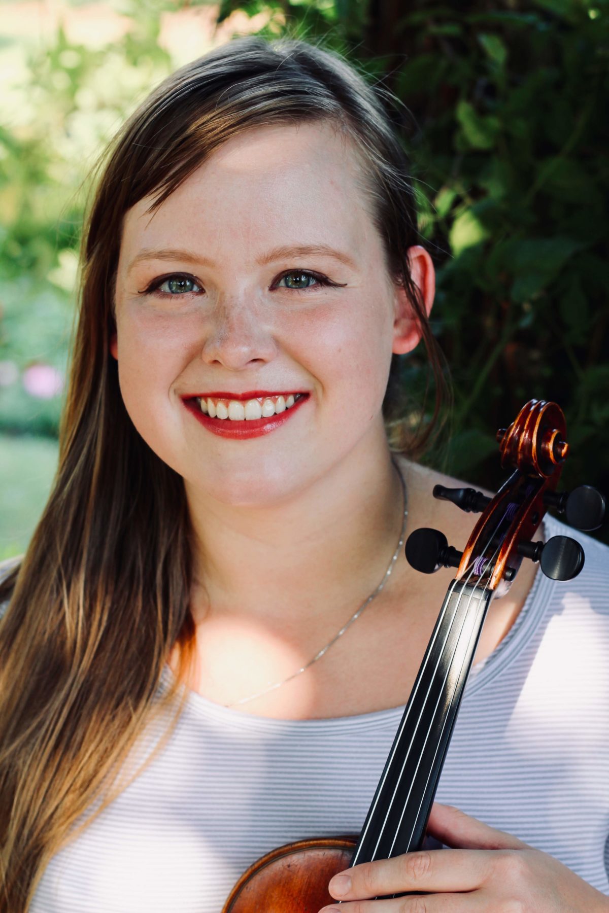 Baily holding a violin