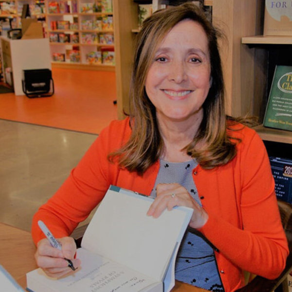 Roma signing a book