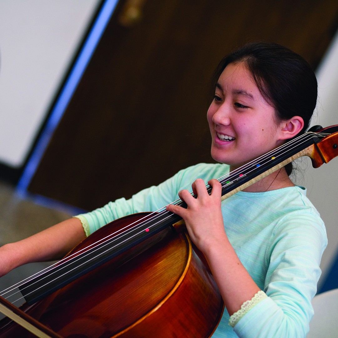 student playing a cello