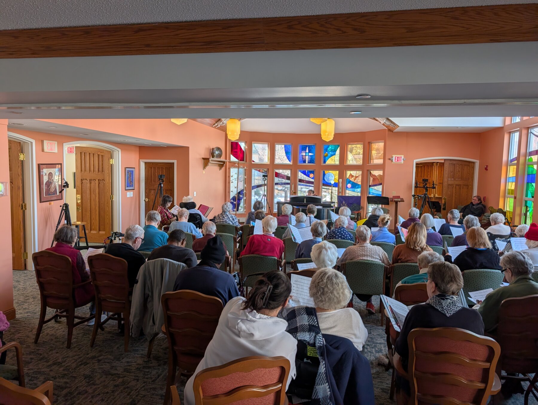 Residents gather at Episcopal Holmes for a recording session