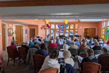 Residents gather at Episcopal Holmes for a recording session