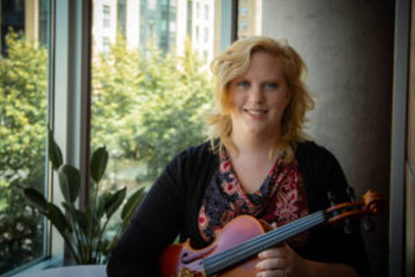 Makayla holding a violin