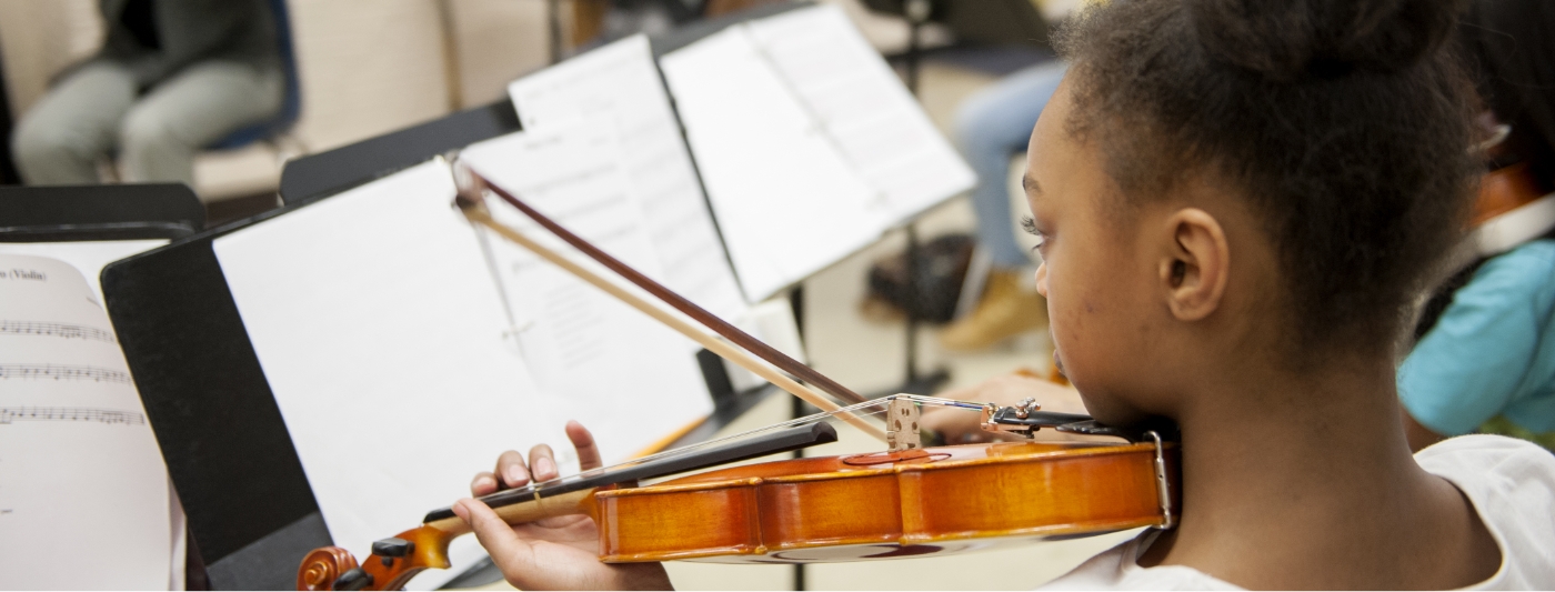 student playing violin