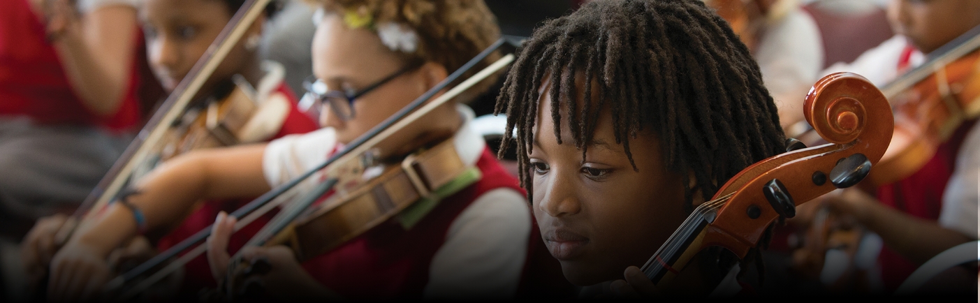 Group of students performing string instruments