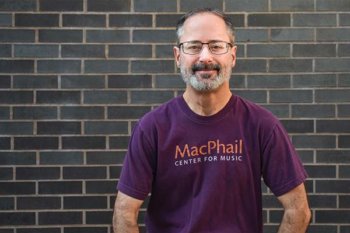 Jeremy wearing a purple MacPhail tshirt