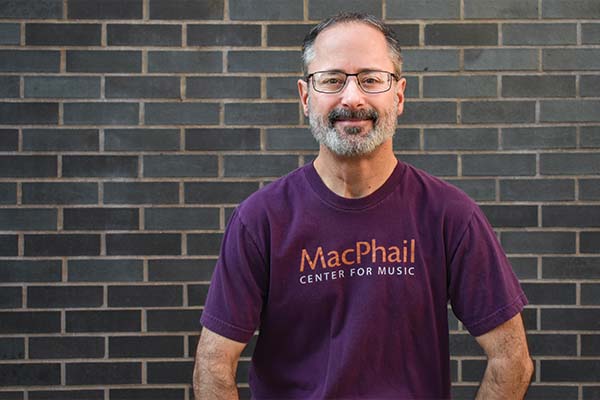 Jeremy wearing a purple MacPhail tshirt