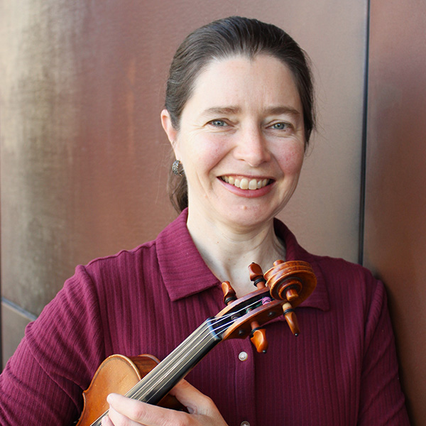 Heather holding a violin