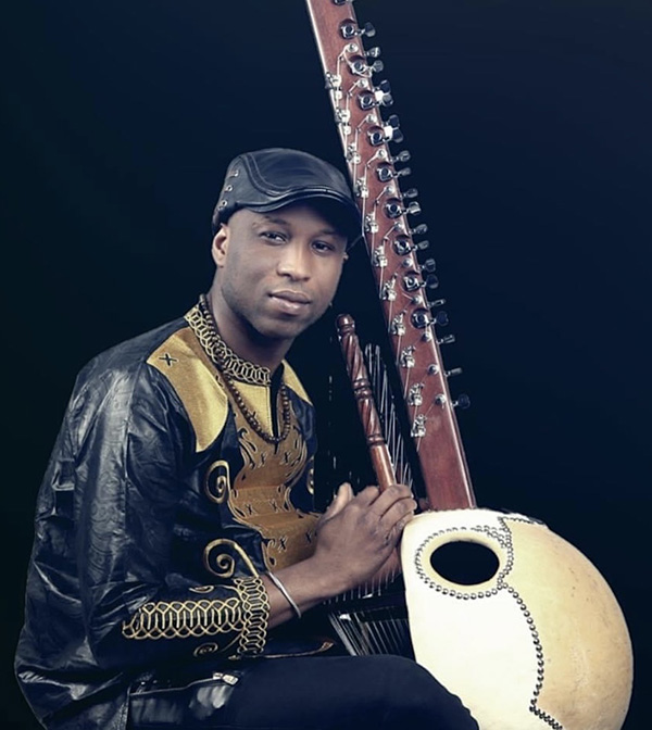 Kadialy Kouyate seated with Kora