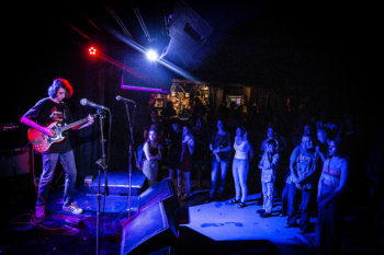 Person playing guitar on stage