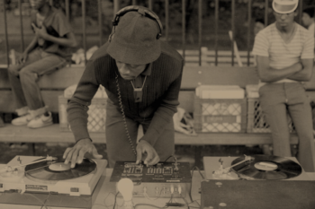 Sepia image of a person djing
