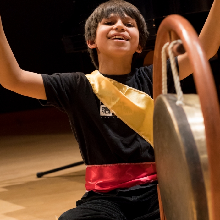 student playing a Korean drum