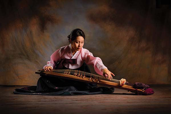 Person playing a gayageum