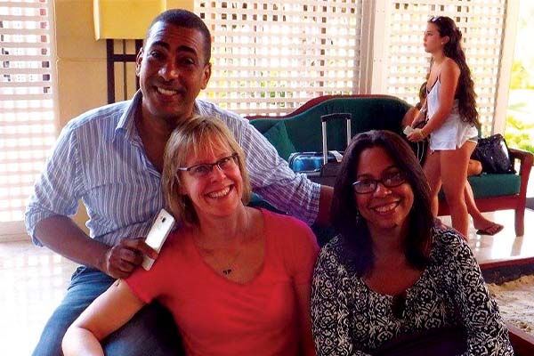 Three people sitting together in a hotel lobby