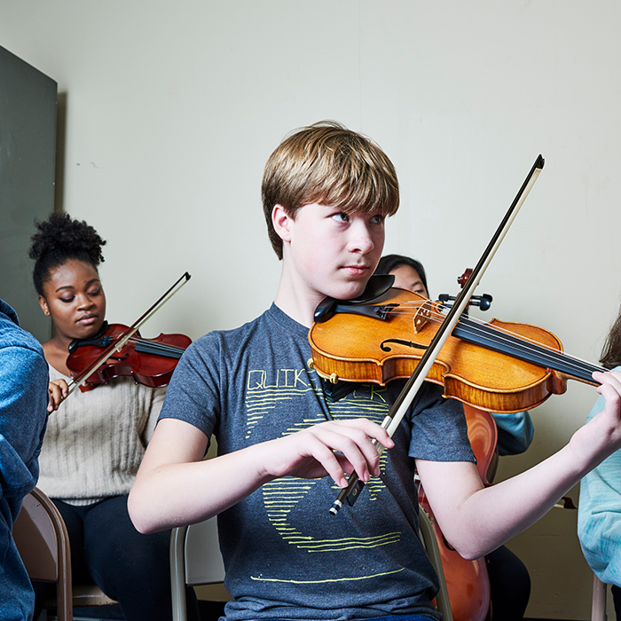 Group of students playing various instruments