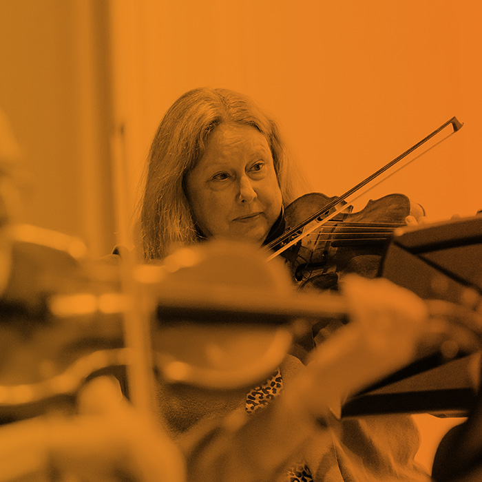adult students learning violin