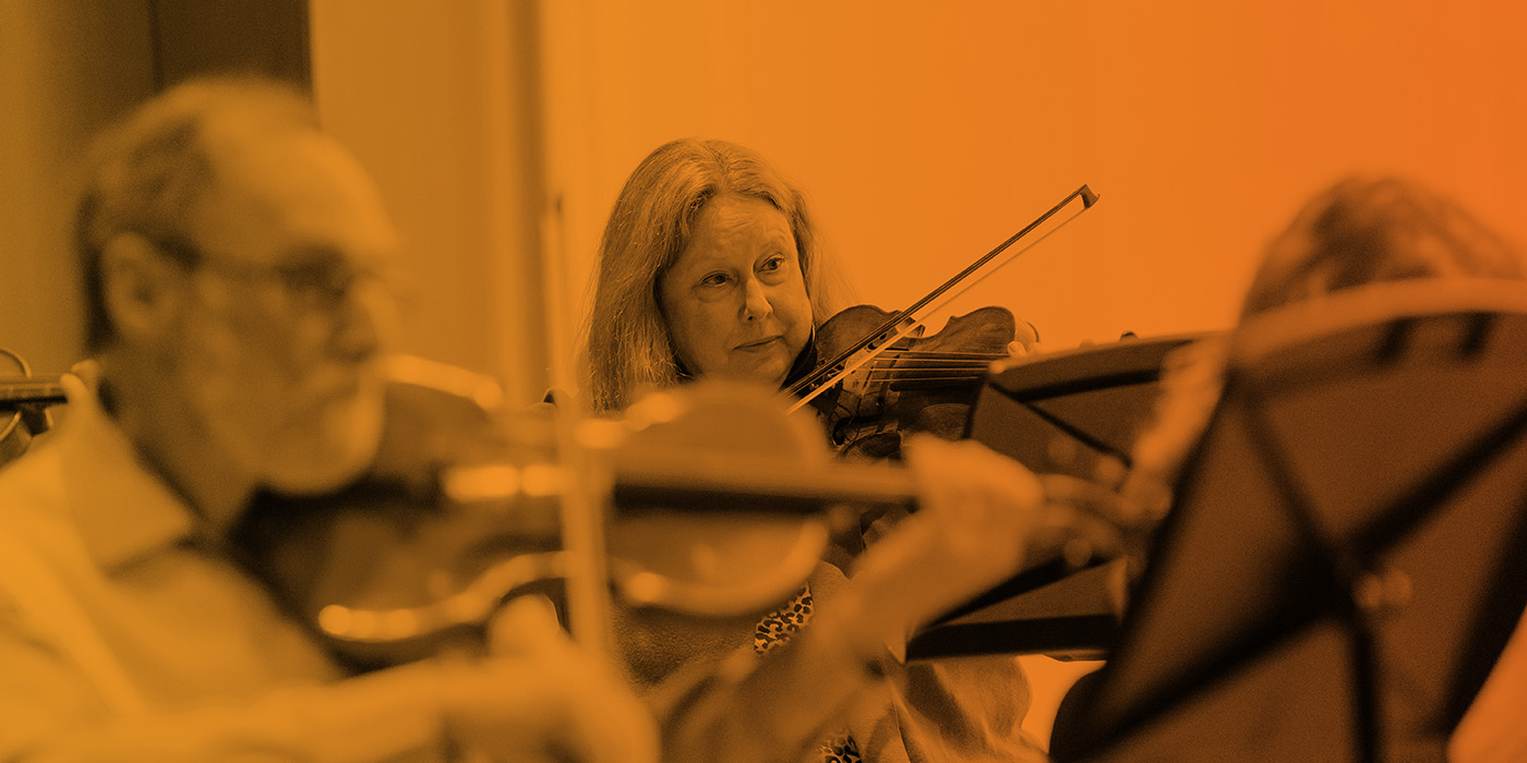 adult students in a group violin class