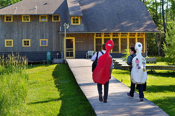 two students walking to a building on Madeline Island