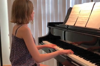 Student playing piano