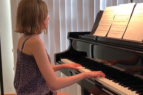 Student playing piano