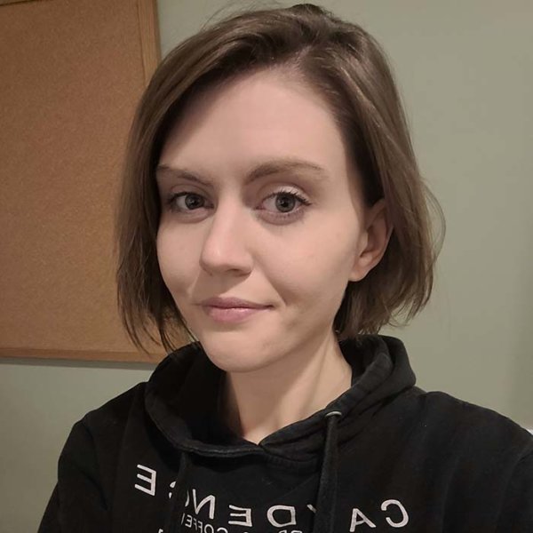 Person with short hair wearing a hoodie