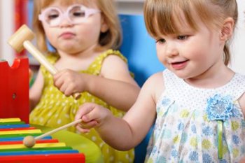 Child playing a xylophone