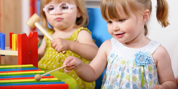 Child playing a xylophone