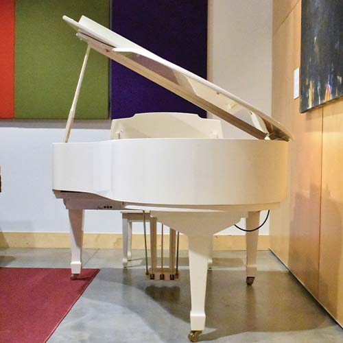 White grand piano with top open