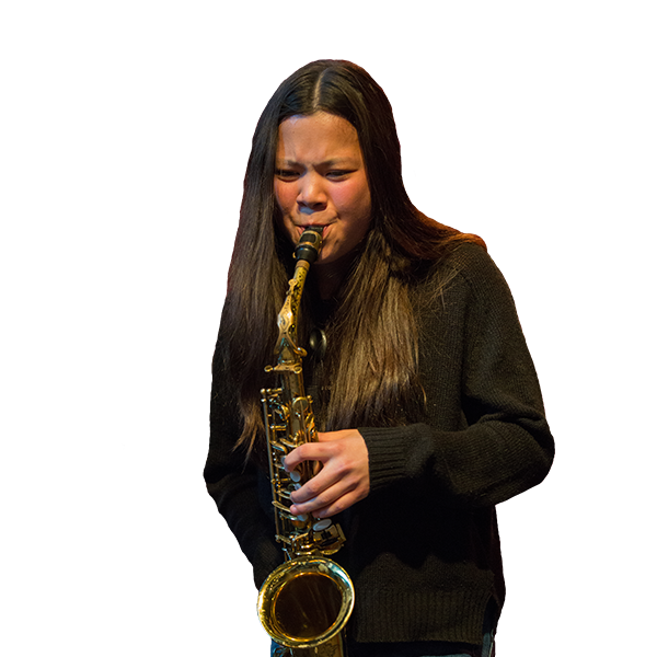 Student wearing a black sweater, playing saxophone