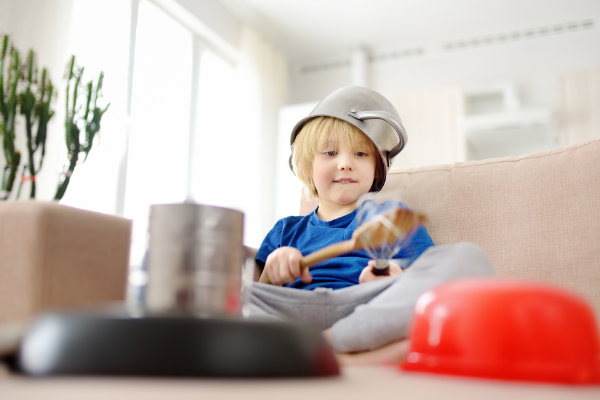 Young child playing with pots and pans