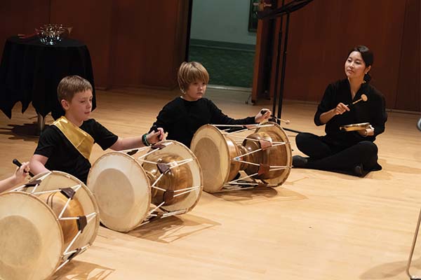 Students playing Korean drums