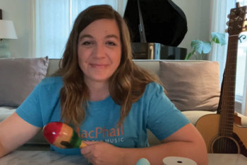 Teacher holding a maraca