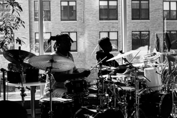 a teacher and his student playing drums