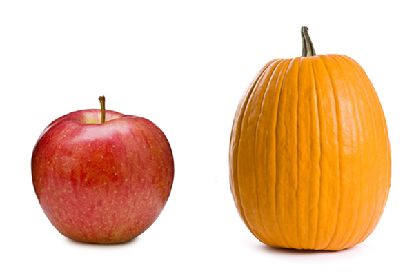a pumpkin next to an apple