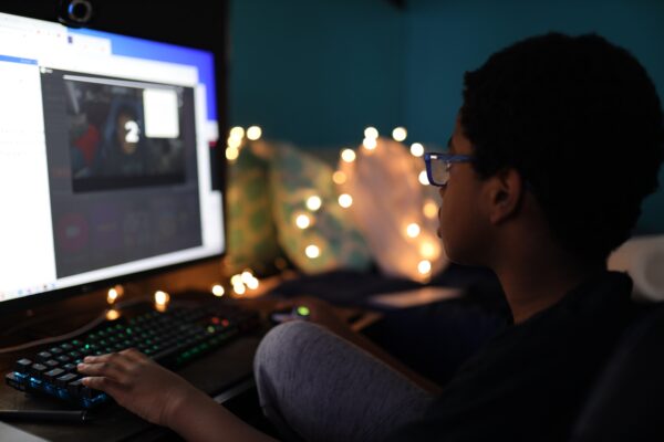 image of boy looking at computer