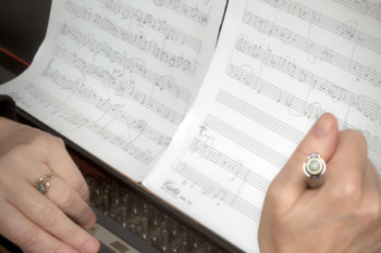 photo of a handwritten music composition in notebook