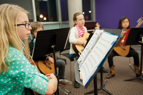 Group of students playing guitar