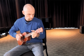Person playing a ukulele